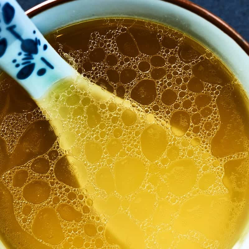 Golden bone broth, close up