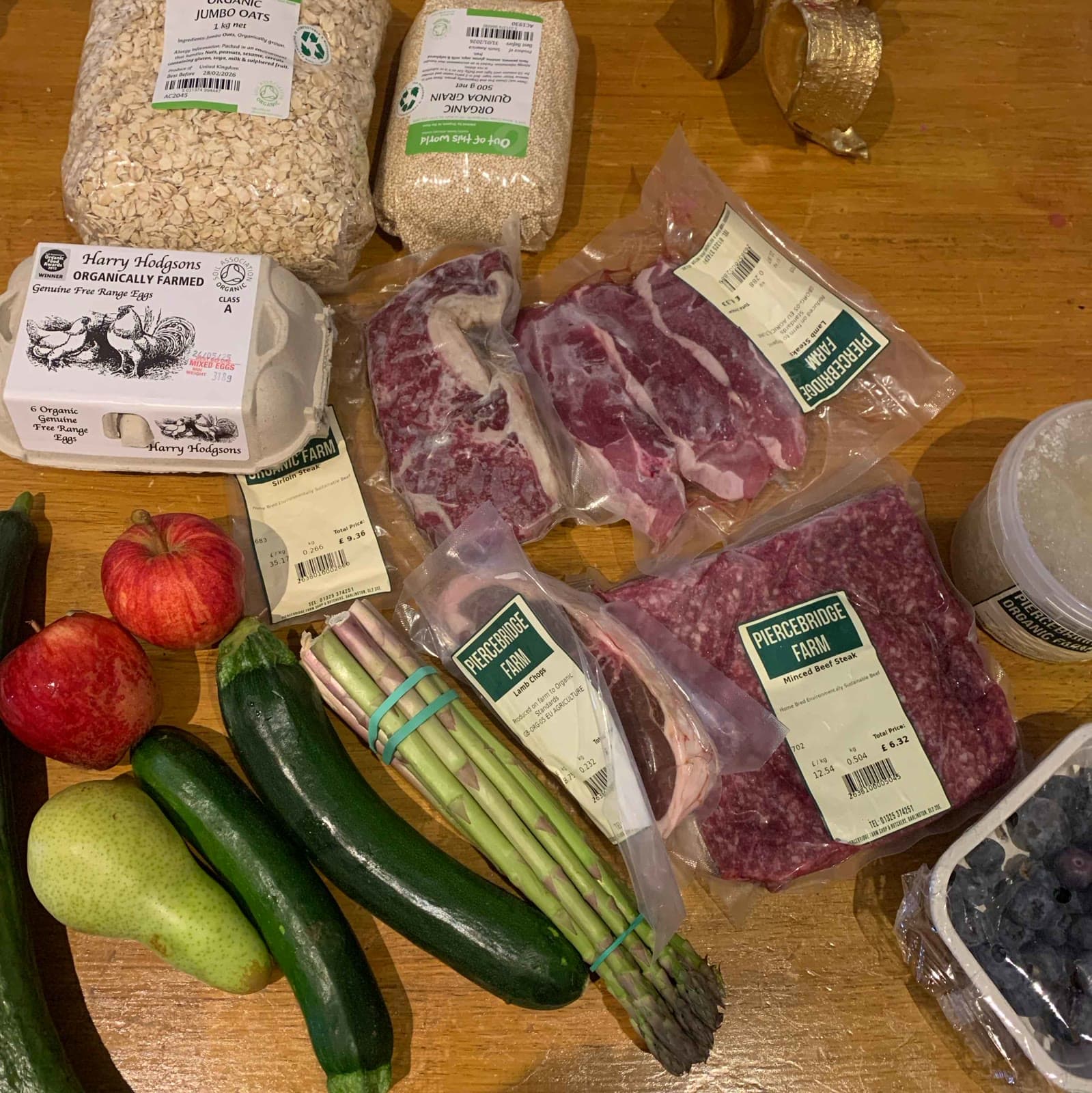 A farm shop haul of meat, vegetables, fruit, eggs and oats from Piercebridge Organics laid out on a table