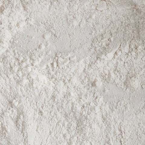 Fine white creatine powder, close up