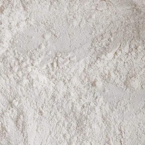 Fine white creatine powder, close up