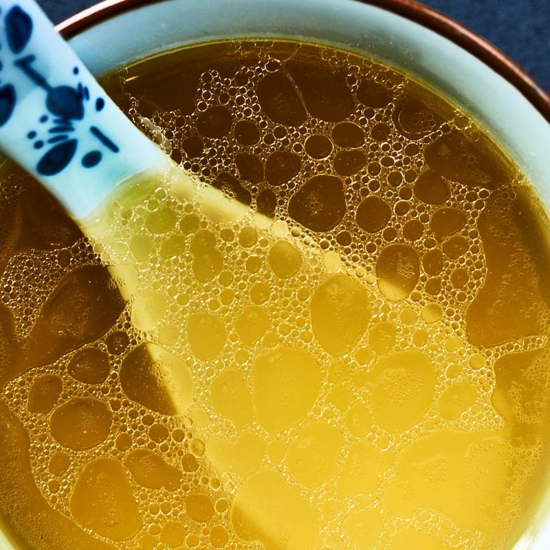 Golden bone broth, close up