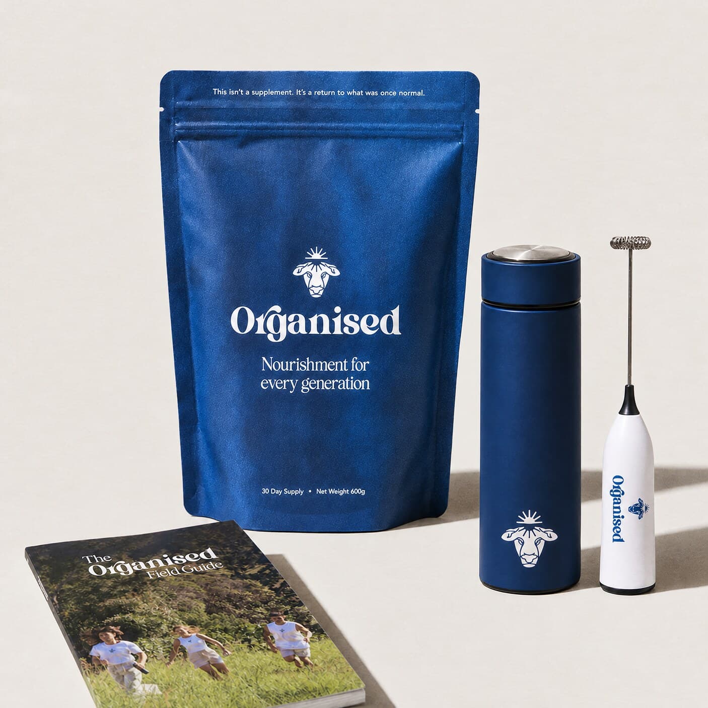 A pouch of Organised with the bottle, the whisk and the field guide